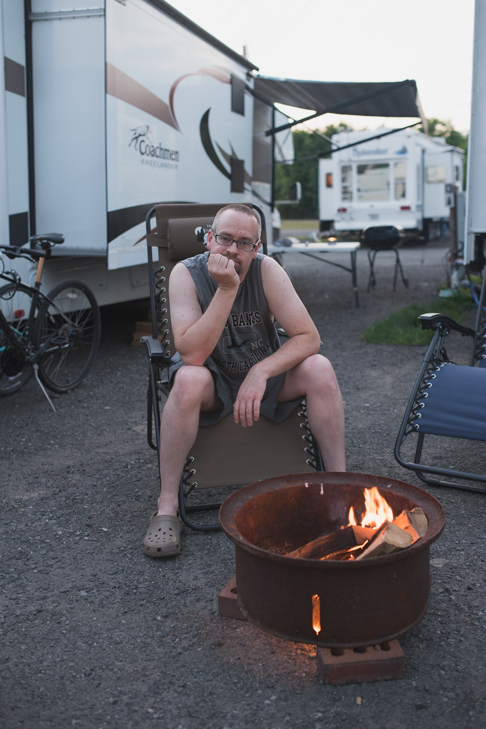 Caveman cooking outdoors with actual fire. 