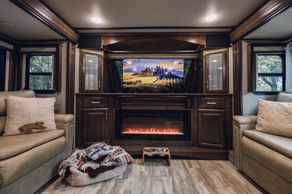grand design solitude 382 front living room fireplace and tv